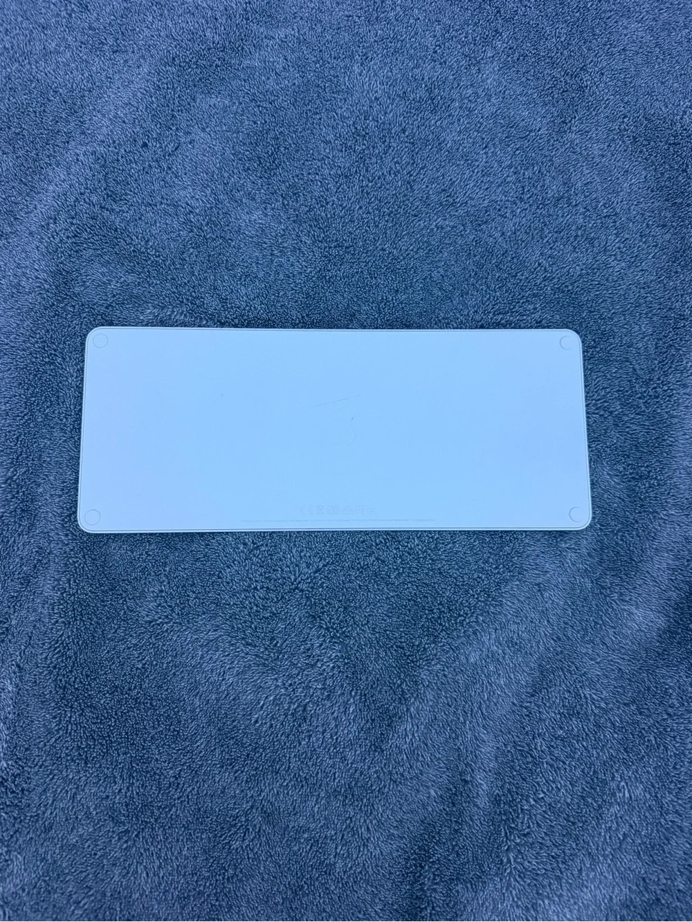 Apple Compact Magic Keyboard in White and Silver lighting cord